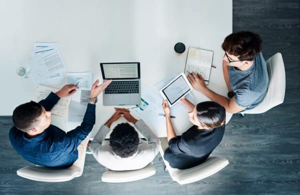 High angle shot of a group of businesspeople having a meeting in a modern office